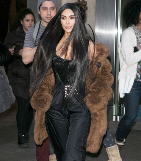 kim kardashian wearing a fur coat.